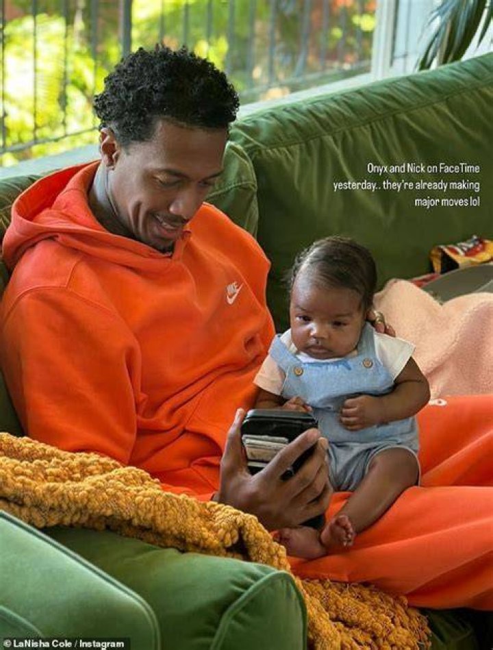 
Nick Cannon Cuddles With Newborn Onyx in Sweet Father-Daughter Photo 